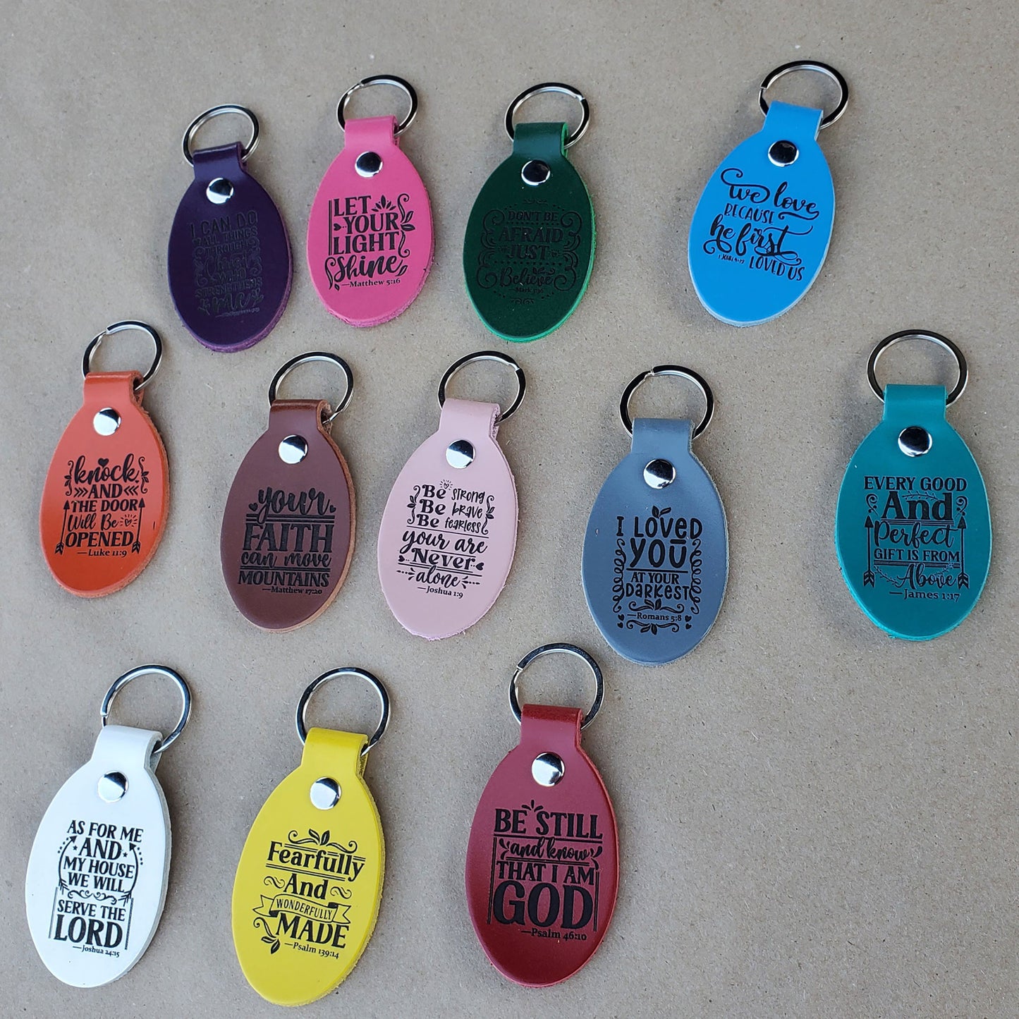 View of leather keychains laser engraved with bible verse before packing