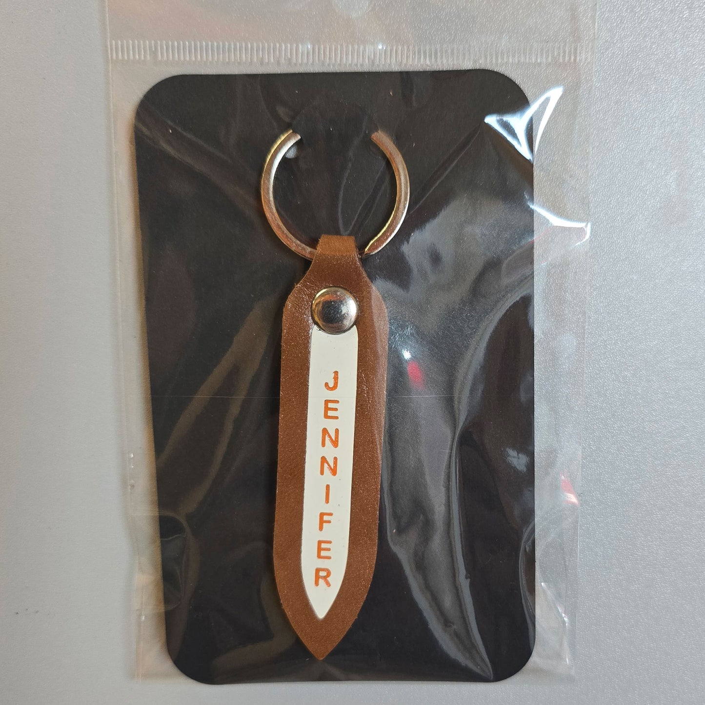 Engraved leather key fob in bright orange on with white insert - gift packed
