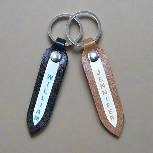 Personalized leather keychain with custom name on white insert