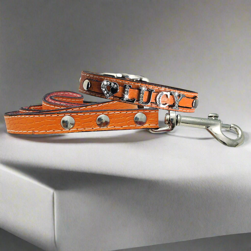 Small breed handcrafted leather collar personalized with a matching leather leash-orange