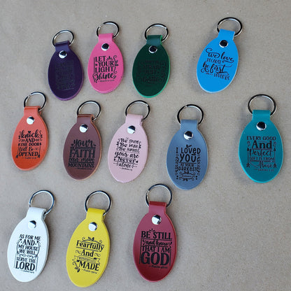 View of leather keychains laser engraved with bible verse before packing