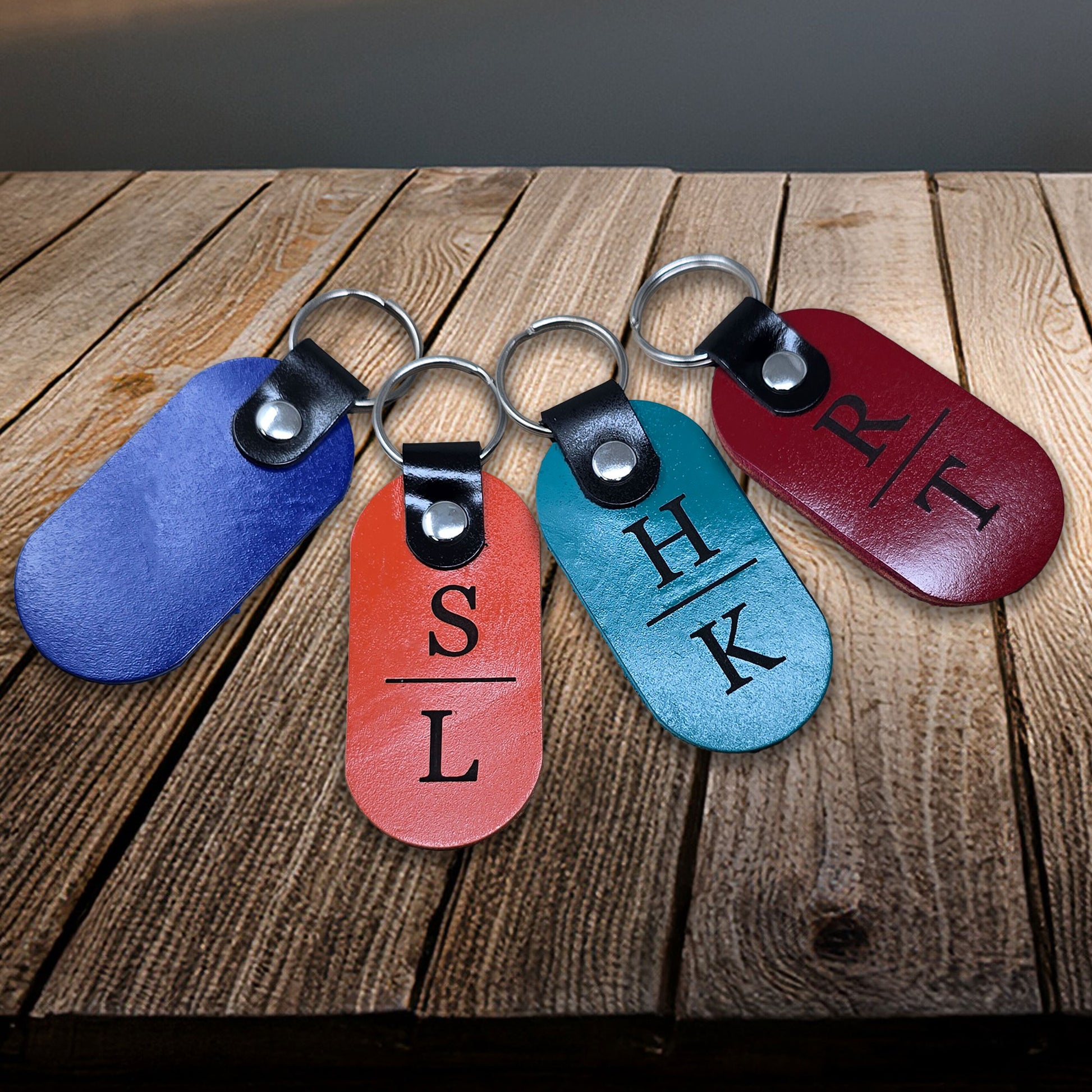 Custom laser-engraved leather keychain featuring initials in 18 vibrant leather colors