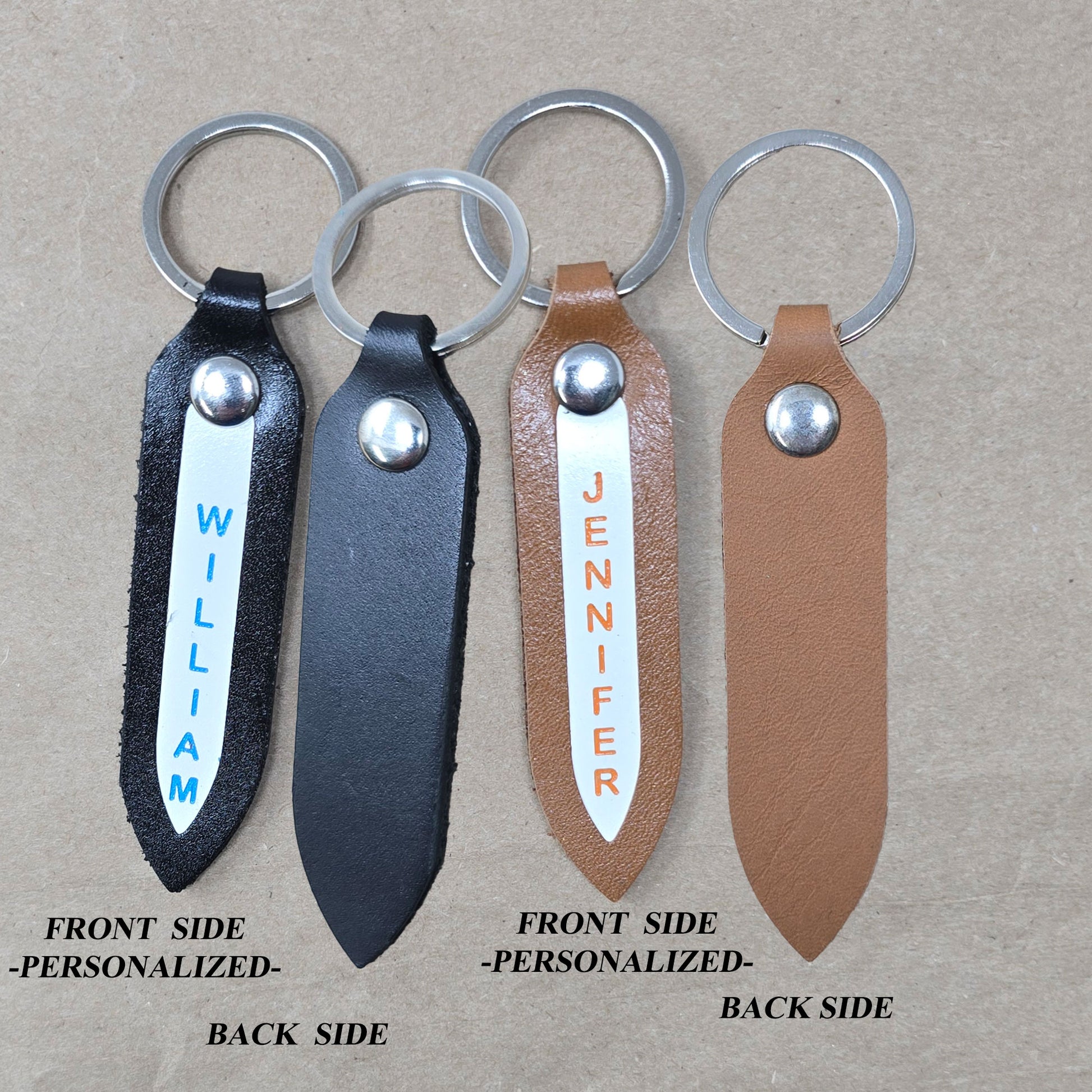 Custom leather keyring in arrow shape with engraved name front and back view
