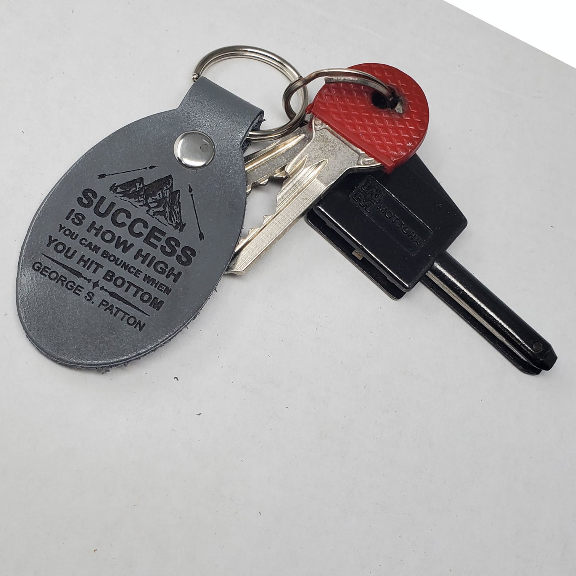 Grey Motivational keychains laser engraved with inspiring quotes